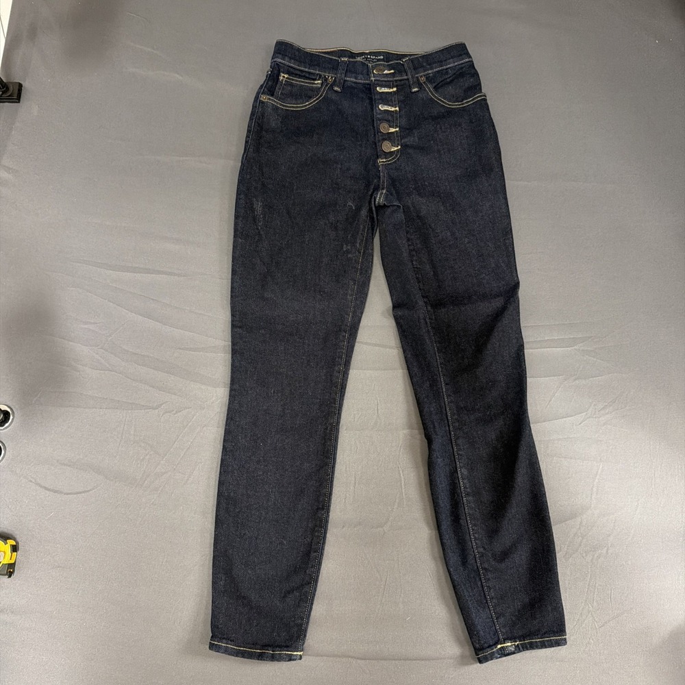 pair of dark wash Lucky Brand button-fly jeans